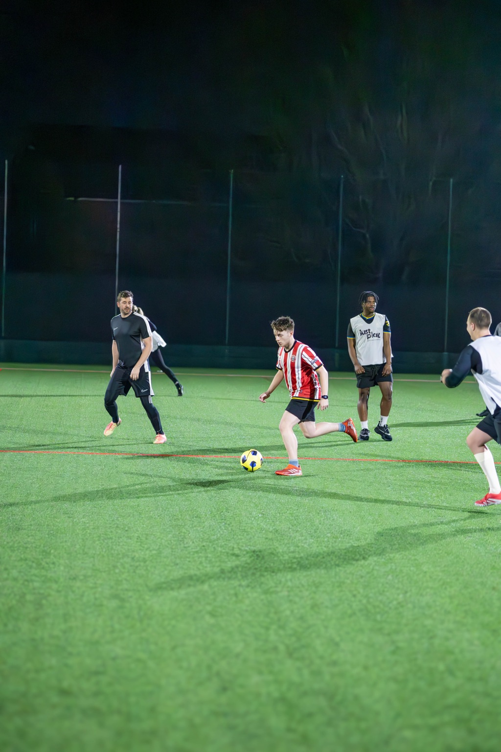 Players in action during a casual football match at an All About Football session