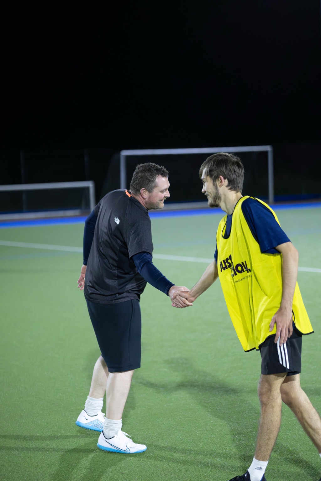 Players shaking hands showing sportsmanship at All About Football